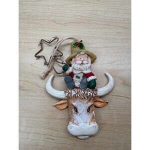 Giordano Christmas Ornament Santa Cowboy Sitting on a Bull's Head with Star